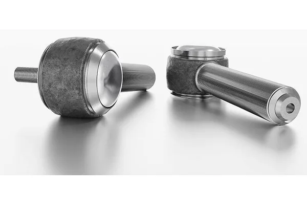 Two articulated roller forming heads, one standing upright and one laid on its side.