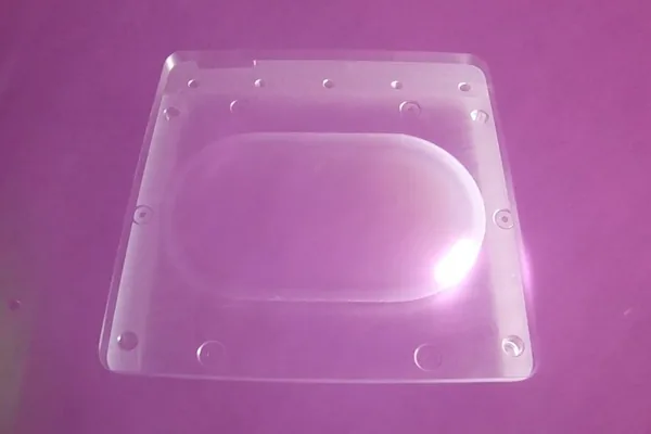 A clear moulded polymer cover laser welded to its mating part.