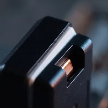 A small moulded polymer housing showing its crisply formed joint face.